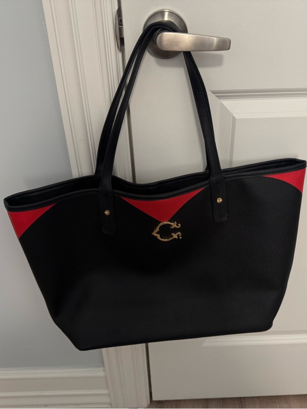 C. Wonder Black & Red Leather Tote with Gold Emblem